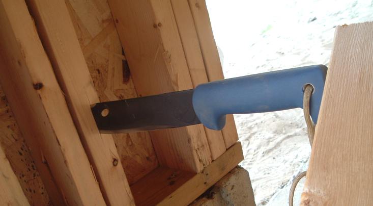 hammering into a stud with a 2 x 4