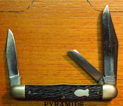 Does this count? There's a light etch on the blade that says &quot;Craftsman&quot; and 9494 and &quot;Hollow Ground&quot;