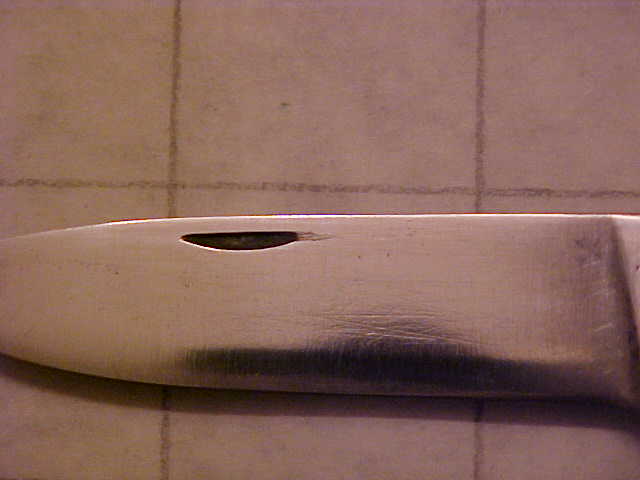 MysteryFolderCloseupofNailMark.JPG
