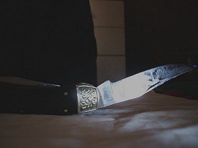 The writing you can't make out reads Made in Pakistan. The steel in this blade is pretty darn wavy