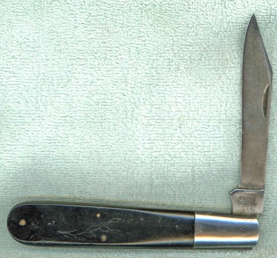 This one has ebony handles. I wish the blade was fuller, but it is still a good user and gets it's share of pocket time.