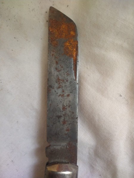 It's hard to tell from the rust, but it reads &quot;Scout Knife&quot; on the blade (along with the usual logo).