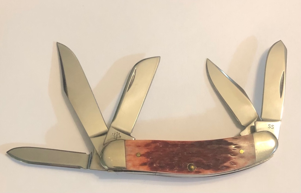 New in Tin 2002 Case. Cranberry 5 Blade Silver Script Sowbelly