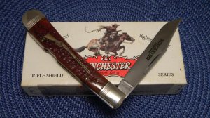 Winchester Trademark USA 1994 Burnt Orange Bone 19107 1/2 Rifle Shield Banana Lockback Knife - NIB