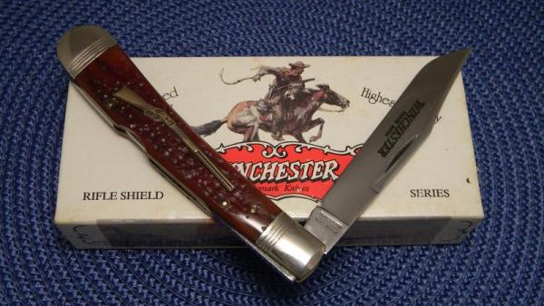 Winchester Trademark USA 1994 Burnt Orange Bone 19107 1/2 Rifle Shield Banana Lockback Knife - NIB Winchester Trademark USA 1994 Burnt Orange Bone 19107 1/2 Rifle Shield Banana Lockback Knife - NIB