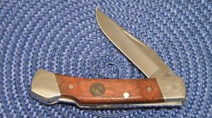 Schrade + USA LTD. Wood Folding Lockback Knife with Duck Shield