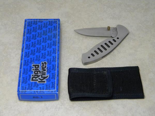 Rigid RG-1 Surgical Steel Japan Plain Edge Metal Linerlock Knife & Pouch in Box Rigid RG-1 Surgical Steel Japan Plain Edge Metal Linerlock Knife & Pouch in Box