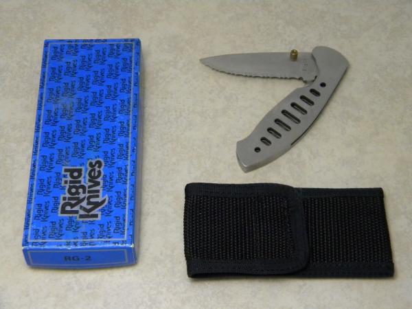 Rigid RG-2 Surgical Steel Japan Serrated Edge Metal Linerlock Knife & Pouch in Box Rigid RG-2 Surgical Steel Japan Serrated Edge Metal Linerlock Knife & Pouch in Box