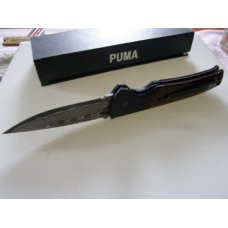 Mint Puma with Damascus blade and original box.