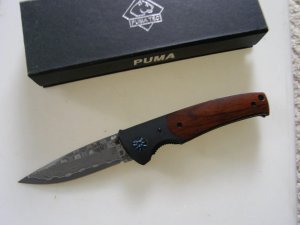 Mint Puma with Damascus blade and original box.