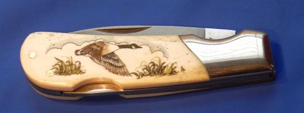 Vintage Frost Single Blade Lock back knife with Highly Detailed Scrimshaw Canadian Goose scene -NOS Vintage Frost Single Blade Lock back knife with Highly Detailed Scrimshaw Canadian Goose scene -NOS