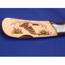 Vintage Frost Single Blade Lock back knife with Highly Detailed Scrimshaw Canadian Goose scene -NOS Vintage Frost Single Blade Lock back knife with Highly Detailed Scrimshaw Canadian Goose scene -NOS