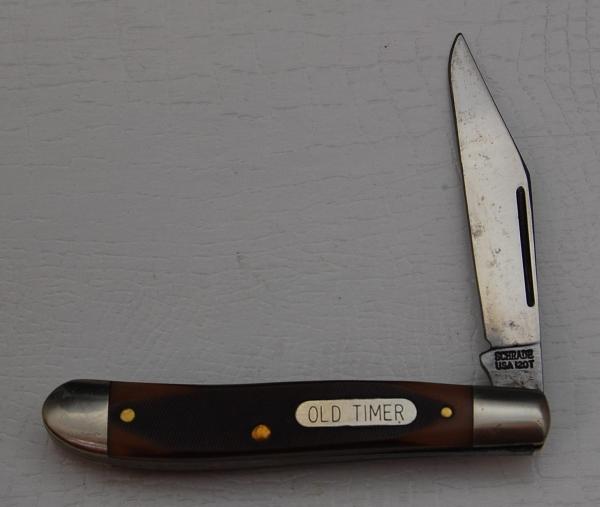 Schrade with Brown Sawcut Synthetic Covers In Very Good Condition (828) Schrade with Brown Sawcut Synthetic Covers In Very Good Condition (828)