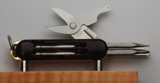 Gerber 4-Blade 2 5/8" Long Multitool In Excellent Condition With Wood Grain Synthetic Covers (927) Gerber 4-Blade 2 5/8" Long Multitool In Excellent Condition With Wood Grain Synthetic Covers (927)