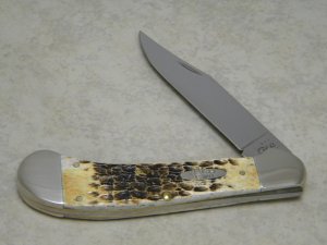 Case XX USA 2011 Burnt Jigged Amber Bone 61100 SS Saddlehorn Knife