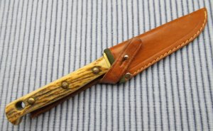 PUMA Buddy 11071 with sheath, box and paperwork. ..................(4)
