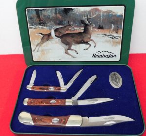 REMINGTON SPORTSMAN SERIES SET OF 3 WOOD HANDLE KNIVES IN A TIN DISPLAY AS NEW YEARS BACK  