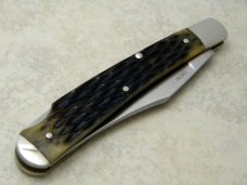 A.G. Russel 2003 Lowell, AR Green Bone Acorn Shield Banana Lockback Knife