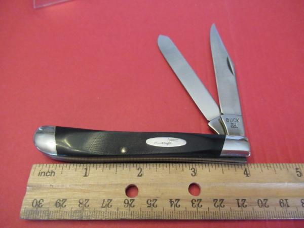 Buck Rough Black Saw Cut  Trapper 