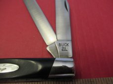 Buck Rough Black Saw Cut  Trapper 