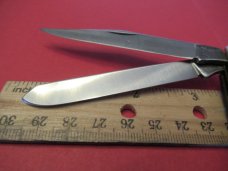 Buck Rough Black Saw Cut  Trapper 