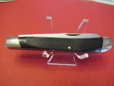 Buck Rough Black Saw Cut  Trapper 
