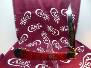 first model case jaguar, 3 dot, red jigged bone. near mint