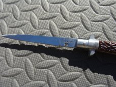 8" Stiletto Switchblade Swivel Bolster Release - Spanish? 8" Stiletto Switchblade Swivel Bolster Release - Spanish?