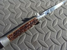 8" Stiletto Switchblade Swivel Bolster Release - Spanish? 8" Stiletto Switchblade Swivel Bolster Release - Spanish?