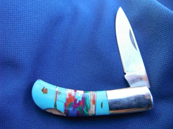 Beautiful inlay scales, lock-back folding pocket knife. Beautiful inlay scales, lock-back folding pocket knife.