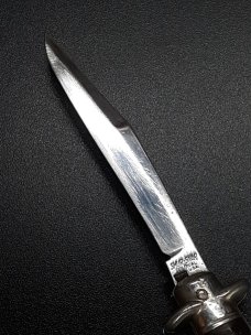 Vintage Shur Snap Bowtie Fishtail switchblade. Vintage Shur Snap Bowtie Fishtail switchblade.
