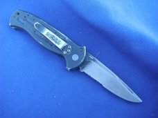 Discontinued Benchmade A.F.O. Automatic Black Blade Combo Edge w/ Safety - 9050SBK Made in the USA!! Discontinued Benchmade A.F.O. Automatic Black Blade Combo Edge w/ Safety - 9050SBK Made in the USA!!