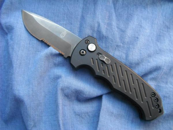 GERBER 06 AUTOMATIC Spear point Blade Fires Hard, Locks Tight, Safety Lock. Made in USA!!! GERBER 06 AUTOMATIC Spear point Blade Fires Hard, Locks Tight, Safety Lock. Made in USA!!!