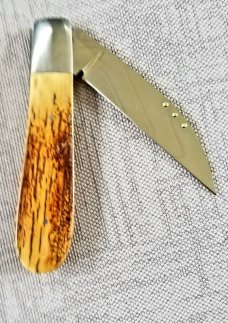 Steve Vanderkolff Mammoth Ivory,4" swayback, he uses dot system for pulls. CPM-154, diamond shield 