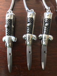Miniature Switchblade Stiletto's, Made in Hong Kong, With Original Retail Advertisement Hanger Miniature Switchblade Stiletto's, Made in Hong Kong, With Original Retail Advertisement Hanger