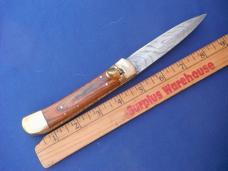 Beautiful Damascus Automatic Knife. Excellent condition, beautiful scales! Striking Damascus pattern Beautiful Damascus Automatic Knife. Excellent condition, beautiful scales! Striking Damascus pattern