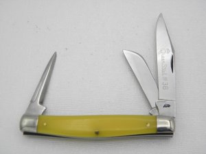 Queen Cutlery #38  Amber Handled Stockman with punch:  3 2/4” closed, 1950s, etched blade