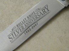 Remington UMC USA 2007 Wood R1128 Silver Anniversary Bullet Trapper Knife in Box Remington UMC USA 2007 Wood R1128 Silver Anniversary Bullet Trapper Knife in Box