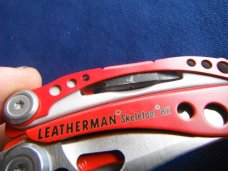 Red Leatherman Skeletool RX Carabiner Multi-Tool Pliers, Serrated Knife with Original Nylon Sheath Red Leatherman Skeletool RX Carabiner Multi-Tool Pliers, Serrated Knife with Original Nylon Sheath