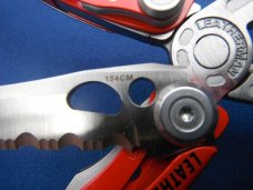 Red Leatherman Skeletool RX Carabiner Multi-Tool Pliers, Serrated Knife with Original Nylon Sheath Red Leatherman Skeletool RX Carabiner Multi-Tool Pliers, Serrated Knife with Original Nylon Sheath