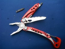 Red Leatherman Skeletool RX Carabiner Multi-Tool Pliers, Serrated Knife with Original Nylon Sheath Red Leatherman Skeletool RX Carabiner Multi-Tool Pliers, Serrated Knife with Original Nylon Sheath