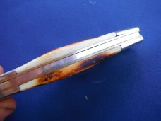 Large Folding slip joint pocket knife with jigged bone scales. Tight blade. Large Folding slip joint pocket knife with jigged bone scales. Tight blade.