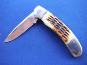 Large Folding slip joint  pocket knife with jigged bone scales.  Tight blade.