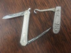 LADIES FINE BUTTON HOOK AND A SILVER MANICURE KNIFE