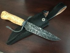 Feathered “W” blade, Karelian Birch handle, extended wrought iron guard, USA maker with sheath Feathered “W” blade, Karelian Birch handle, extended wrought iron guard, USA maker with sheath