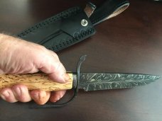 Feathered “W” blade, Karelian Birch handle, extended wrought iron guard, USA maker with sheath Feathered “W” blade, Karelian Birch handle, extended wrought iron guard, USA maker with sheath