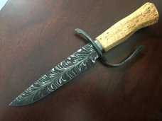 Feathered “W” blade, Karelian Birch handle, extended wrought iron guard, USA maker with sheath Feathered “W” blade, Karelian Birch handle, extended wrought iron guard, USA maker with sheath