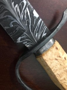 Feathered “W” blade, Karelian Birch handle, extended wrought iron guard, USA maker with sheath Feathered “W” blade, Karelian Birch handle, extended wrought iron guard, USA maker with sheath