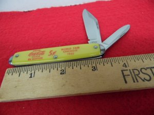 MOSTLY STORED FOR YEARS NOVELTY JACK KNIFE USA COCA COLA YELLOW HAS LIGHT OIL STAINS COLLECTIBLE