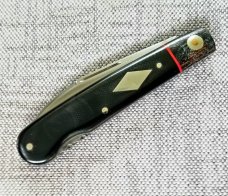 K'roo Custom Swayback Lockback W/ slip, 4" closeD micarta, spacers and liners filework K'roo Custom Swayback Lockback W/ slip, 4" closeD micarta, spacers and liners filework